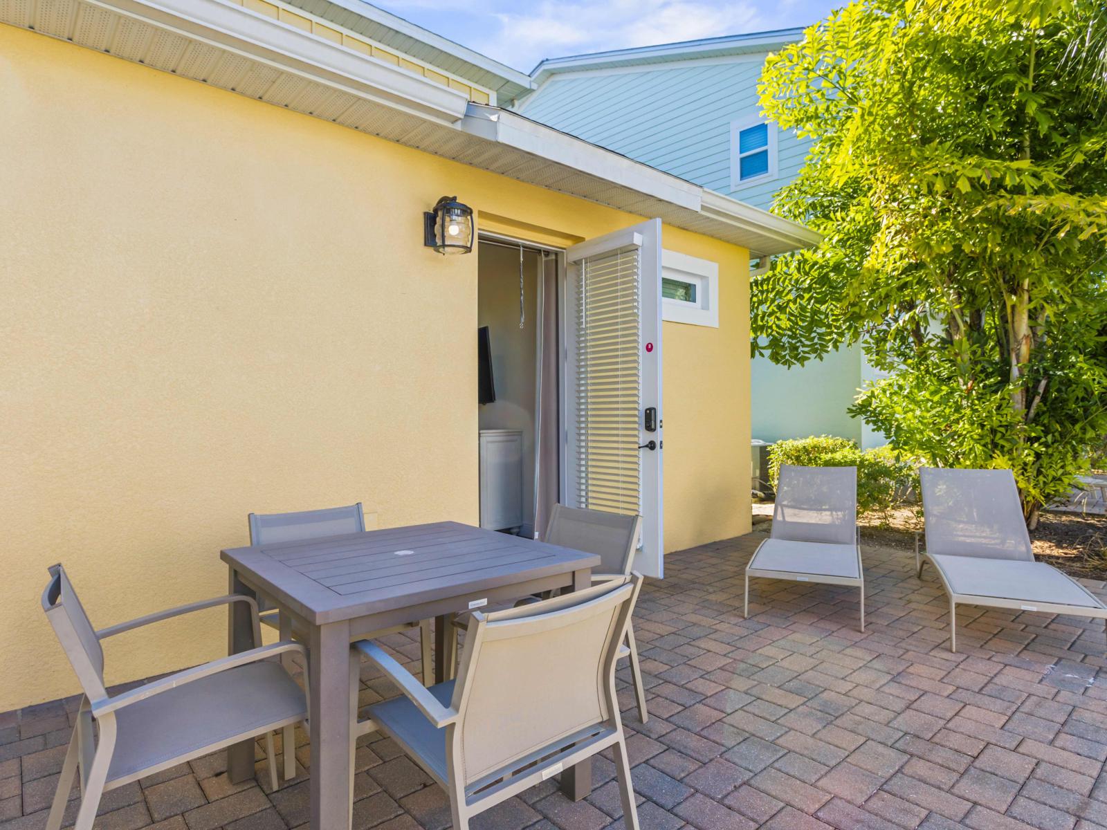 Outdoor dining area and lounge chairs