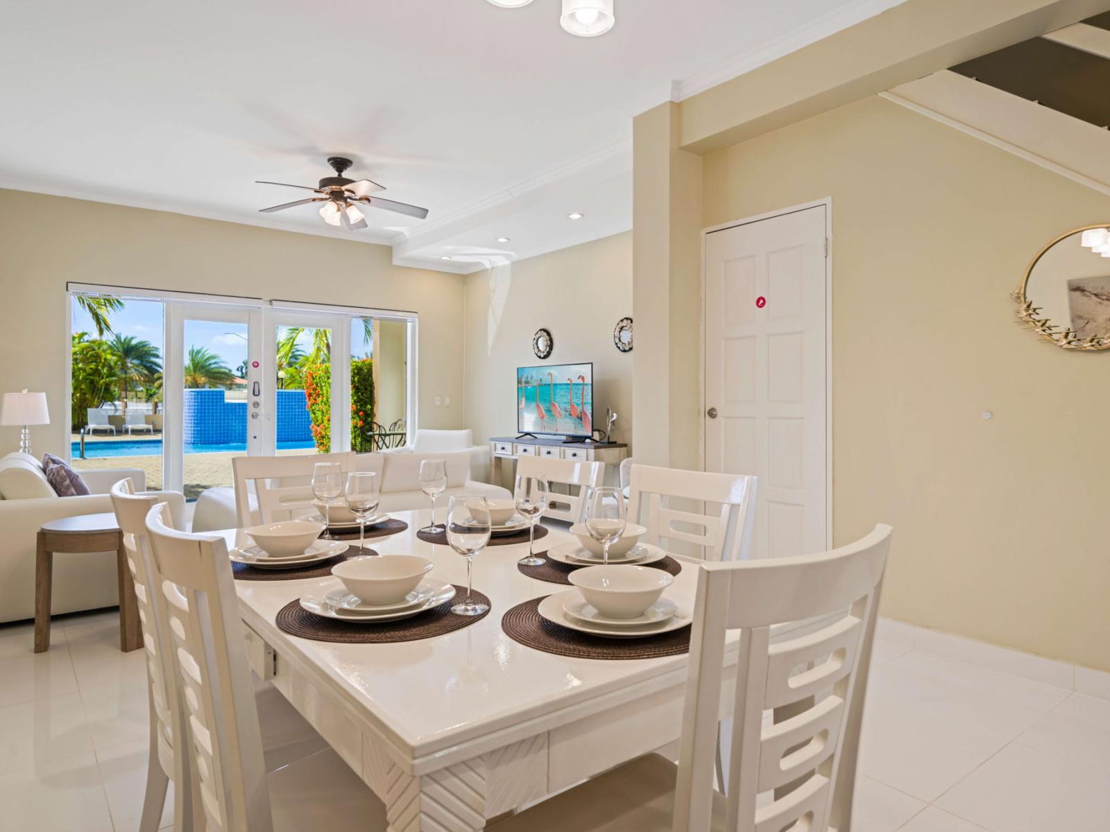 Enjoy poolside views from the dining area, featuring a stylish 6-seater table conveniently located next to the cozy living space – an Airbnb dining experience to remember!