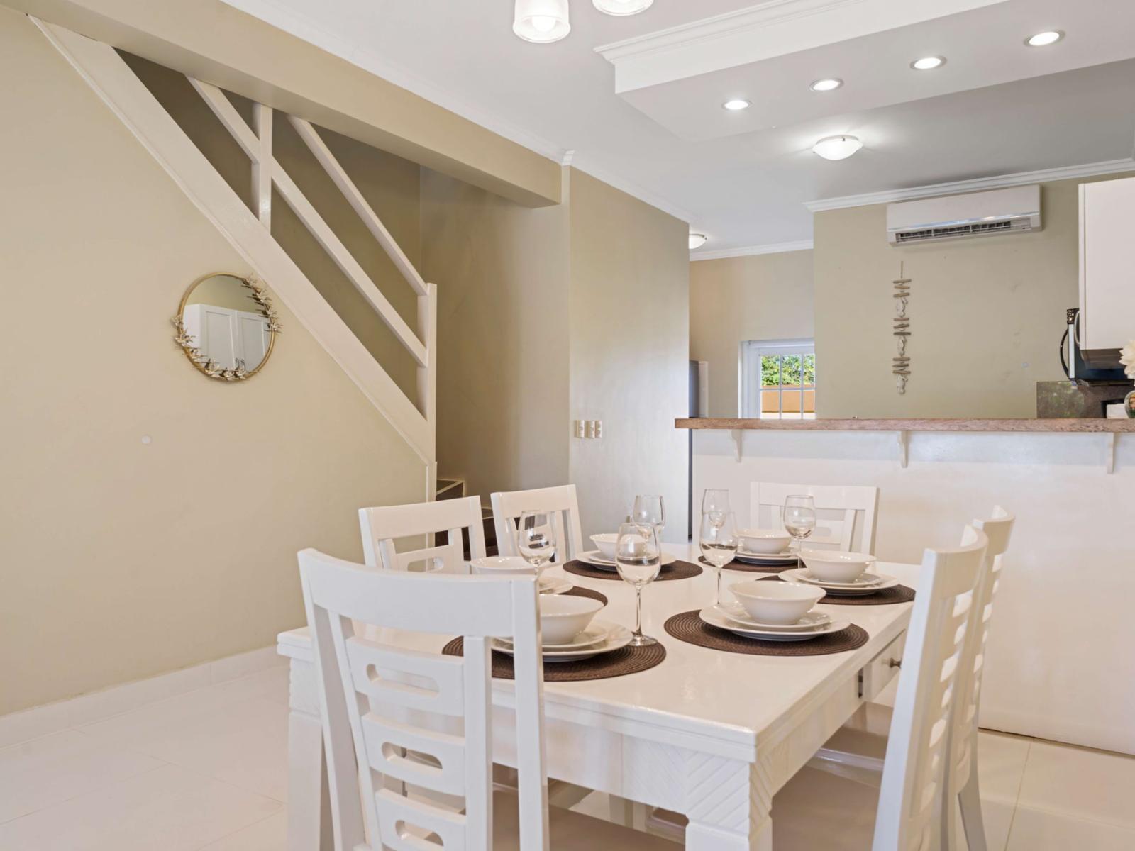 Enjoy poolside views from the dining area, featuring a stylish 6-seater table conveniently located next to the cozy living space – an Airbnb dining experience to remember!