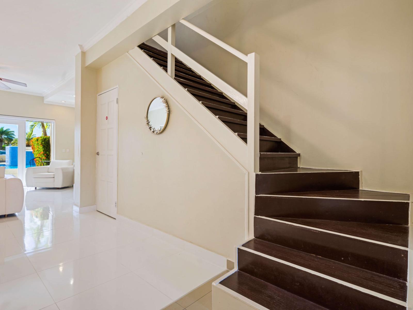 Take the stylish stairs to the second floor, leading you to your cozy retreat – adding a touch of elegance to your Airbnb experience!