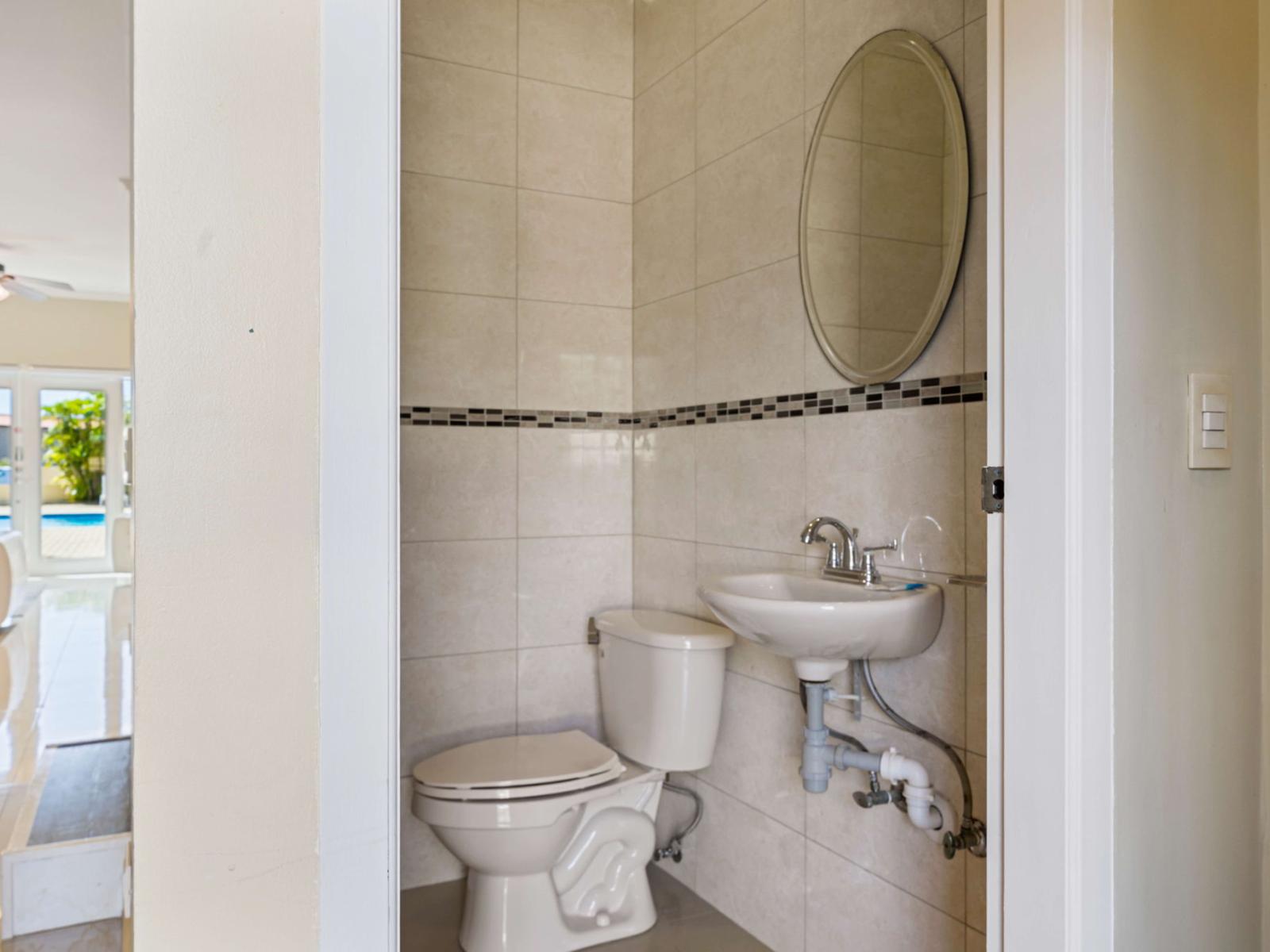 Convenient half bathroom on the first floor, perfect for guests – adding comfort and accessibility to your Airbnb stay!