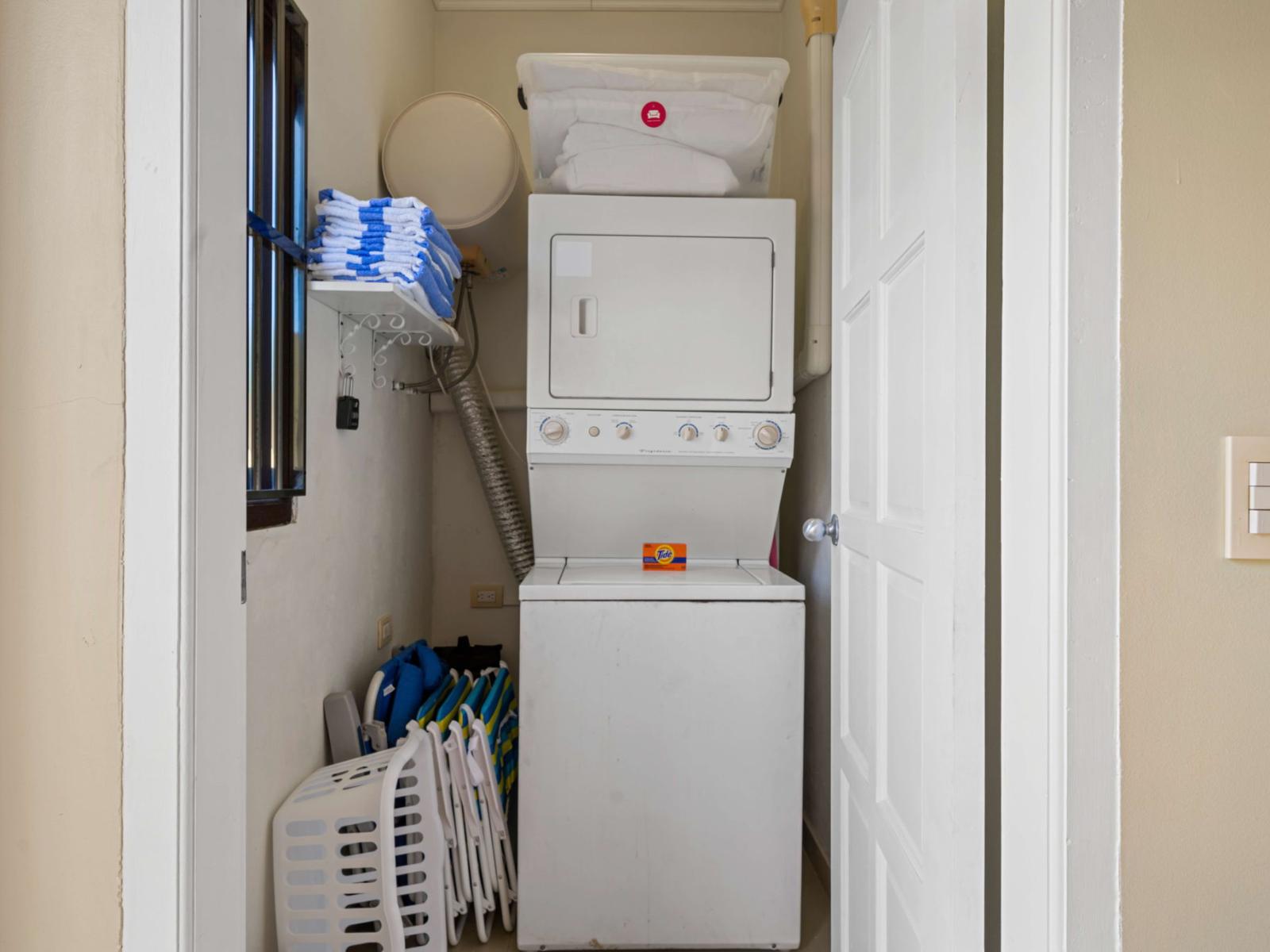 Convenient laundry area in the condo, equipped with a washer and dryer – making your Airbnb stay even more comfortable and hassle-free!