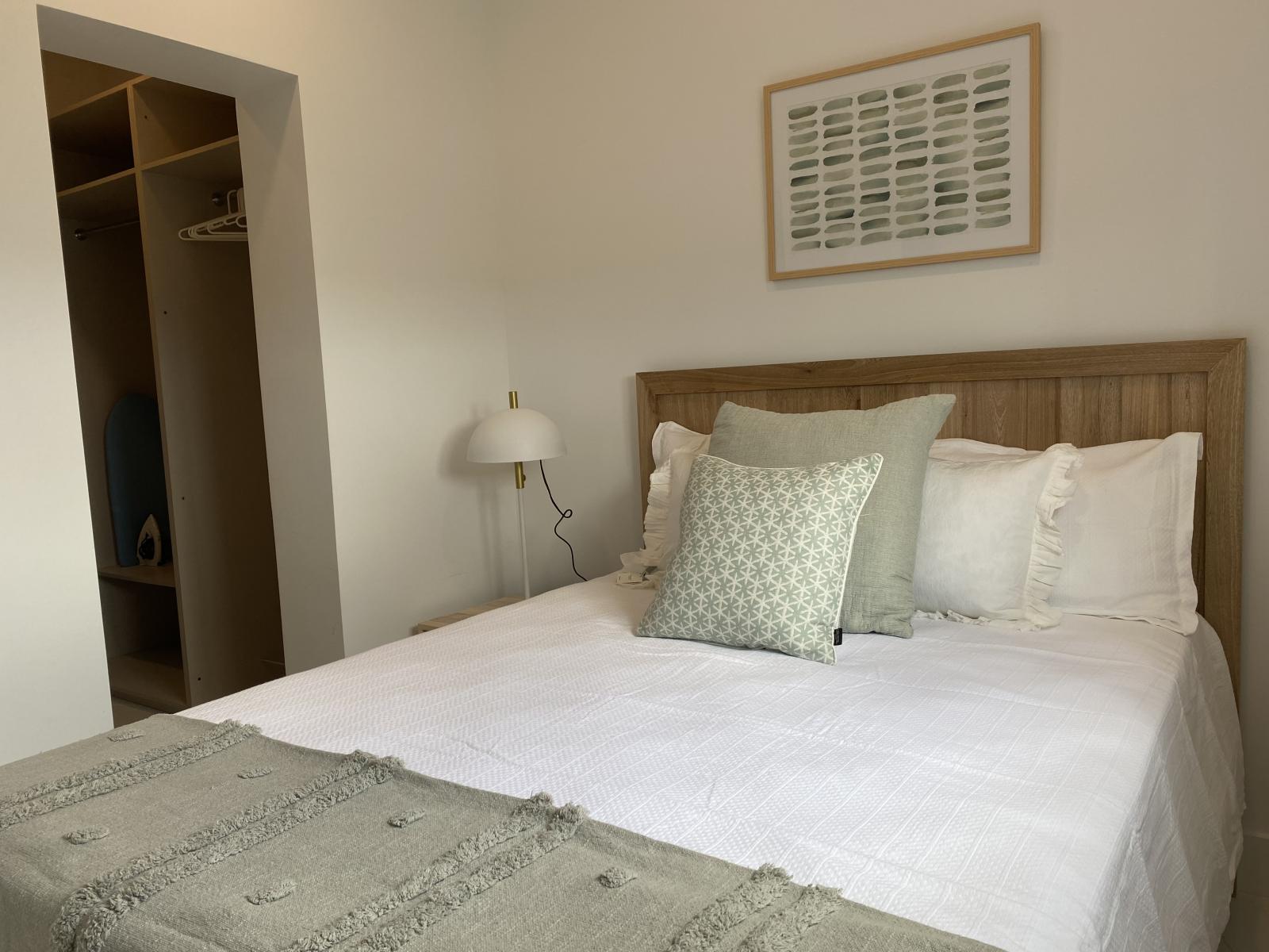 Unwind in a stylish queen size bed with soft linens & plush pillows for ultimate relaxation - Warm, inviting space designed for a restful night’s sleep after a day of exploring - Thoughtfully decorated with modern touches to make you feel at home