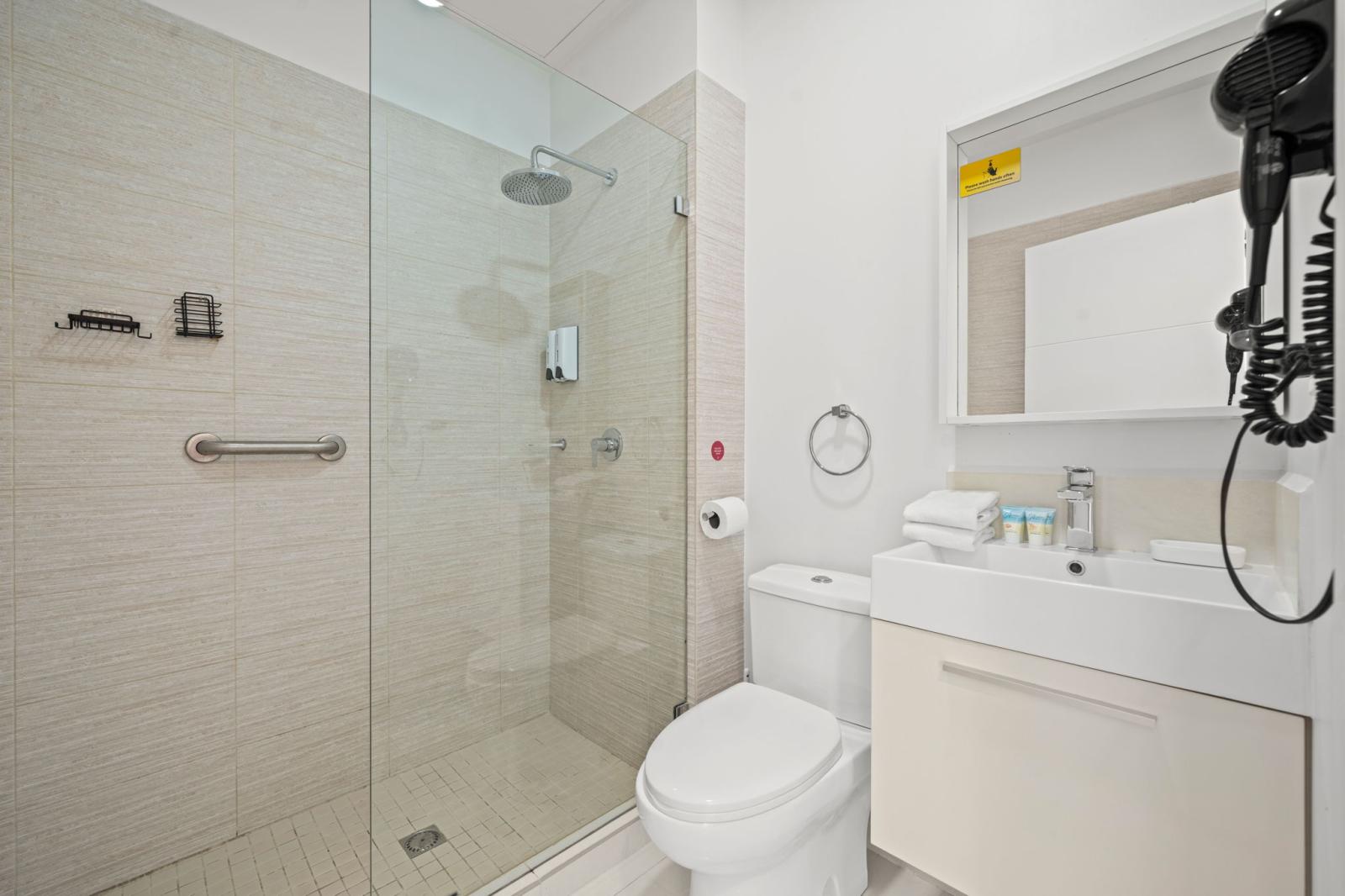 Indulge in a spa like escape with a sleek rainfall shower and glass enclosure - Crisp, clean, and beautifully designed for a refreshing start to your day