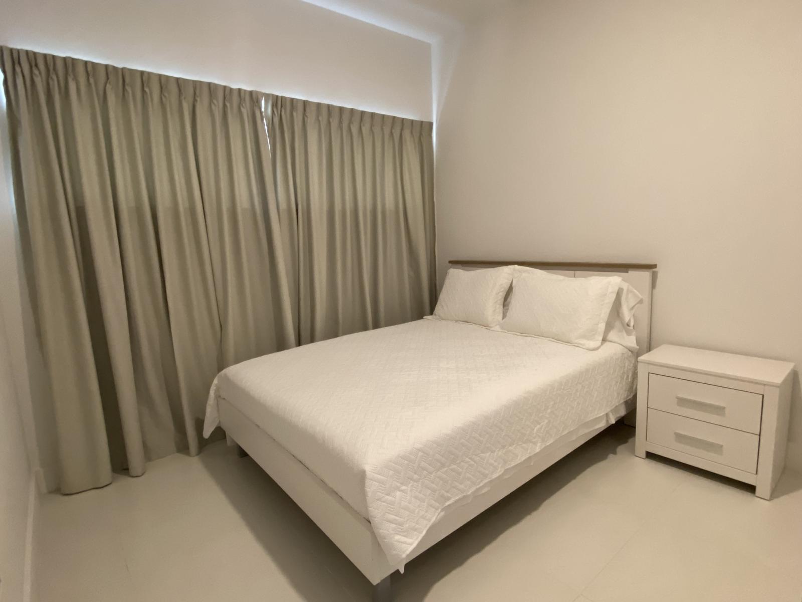 Bedroom 2 offers a queen size bed and shades to keep the sunlight out for a great nights rest