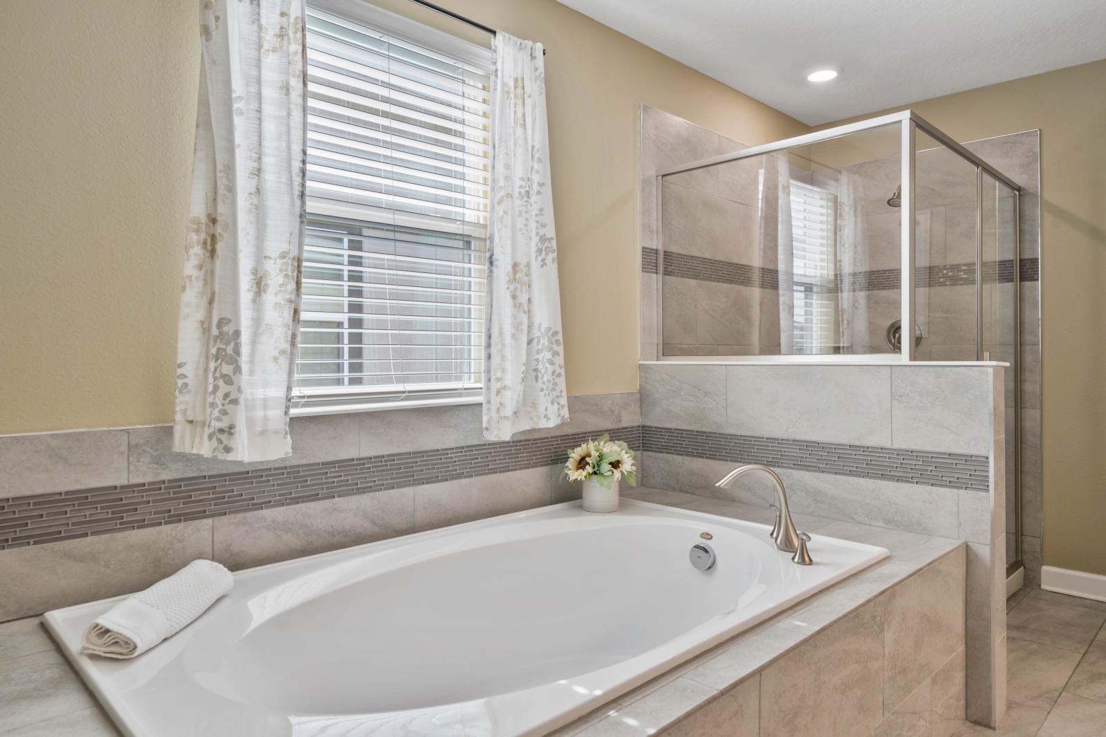 Bathroom 3 with a bathtub and a walk-in shower