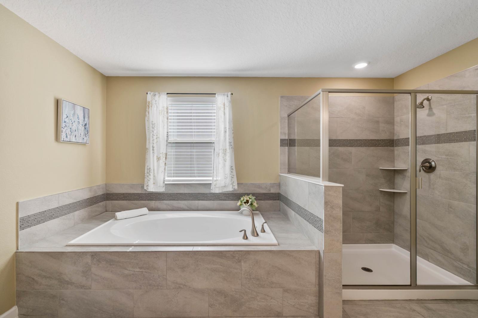 Bathroom 3 with a bathtub and a walk-in shower