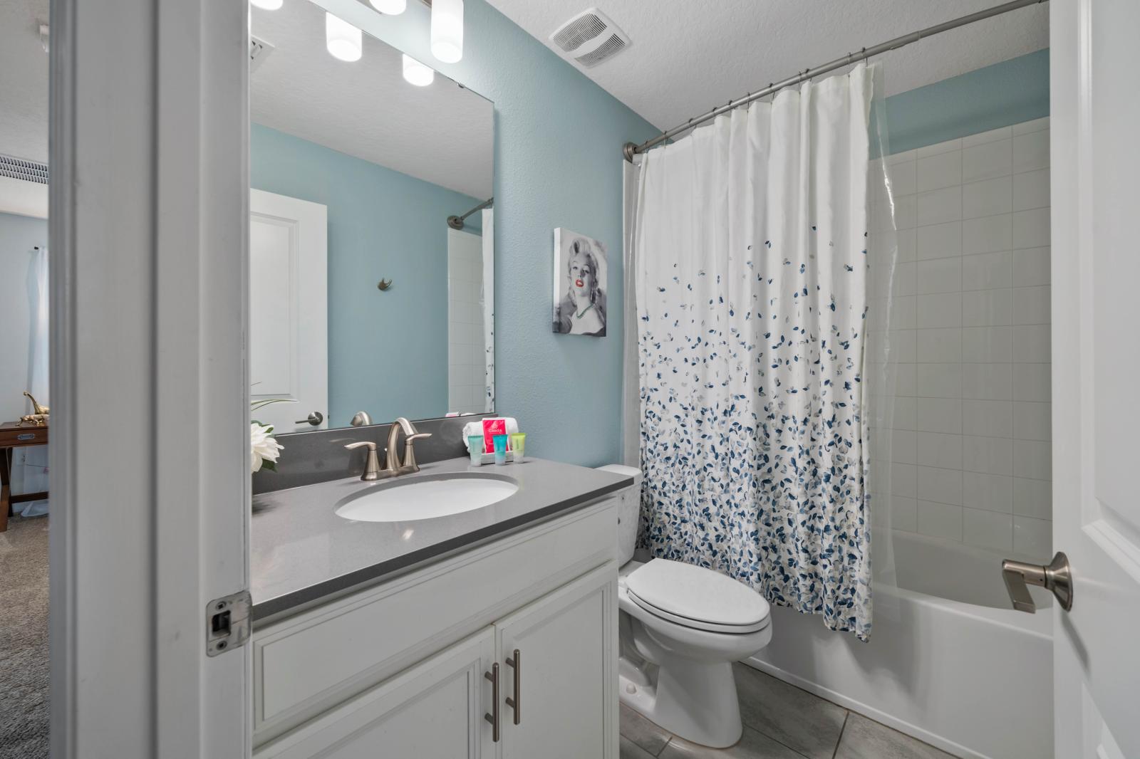 Bathroom 5 with a bathtub and shower combo