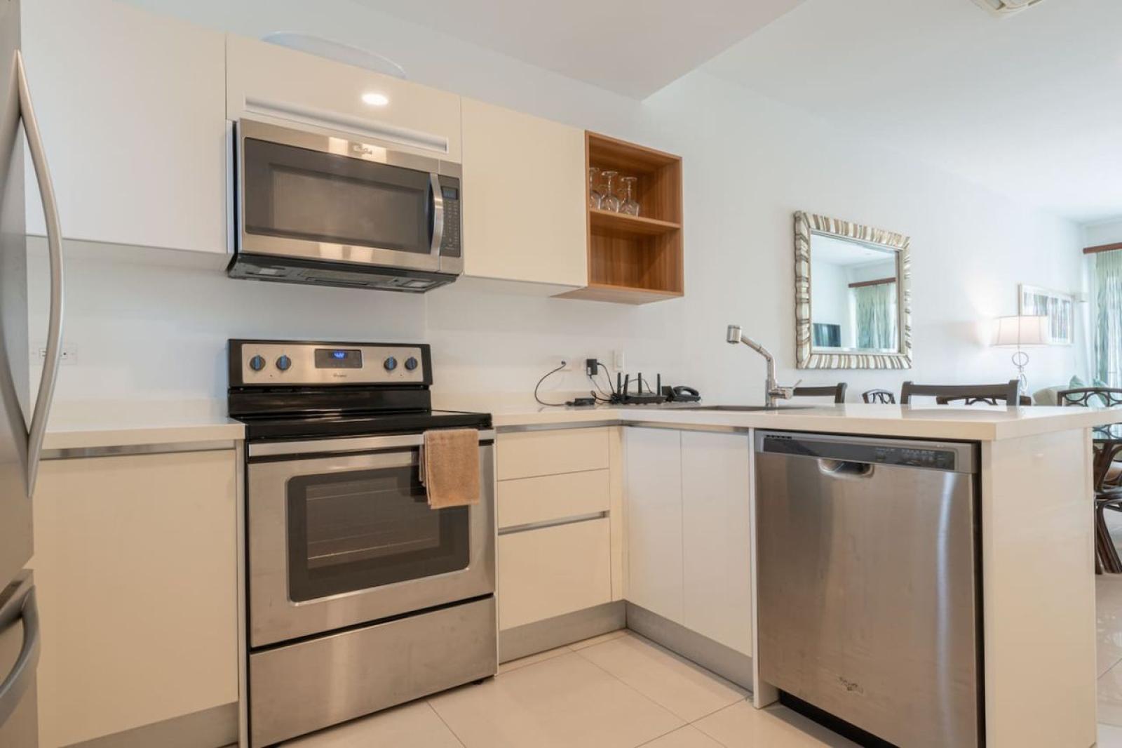 Well equipped kitchen with modern appliances makes meal prep simple & enjoyable - Sleek countertops & plenty of space provide convenience for cooking or snacking - Enjoy a home cooked meal before heading out to Noord’s beaches, shops & sights