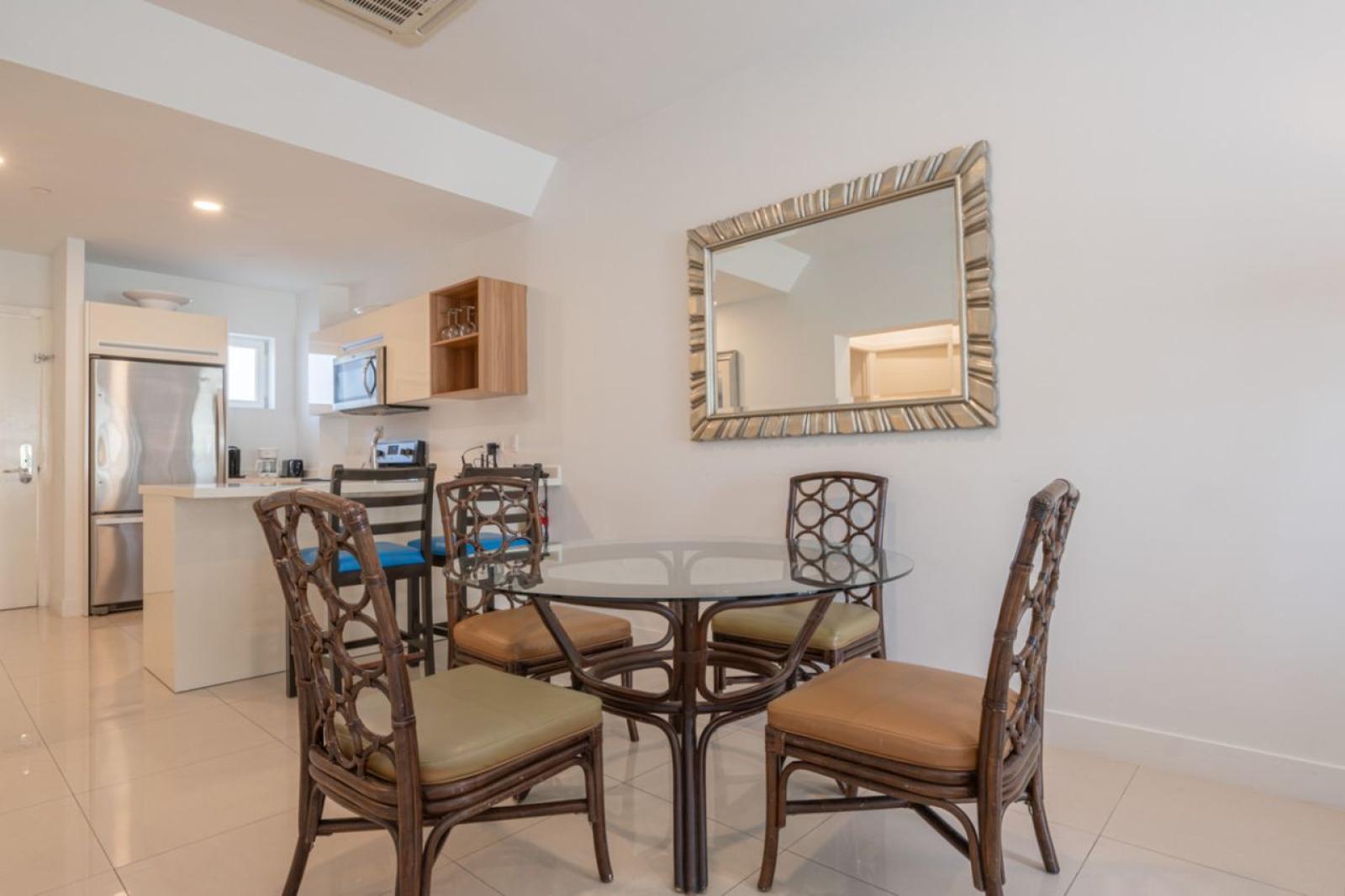 Gather around this inviting dining area designed for comfort and connection - Enjoy delicious meals, share stories, and plan your next Aruba adventure - Perfect space to relax after experiencing Noord’s famous beaches, shops, and local flavors