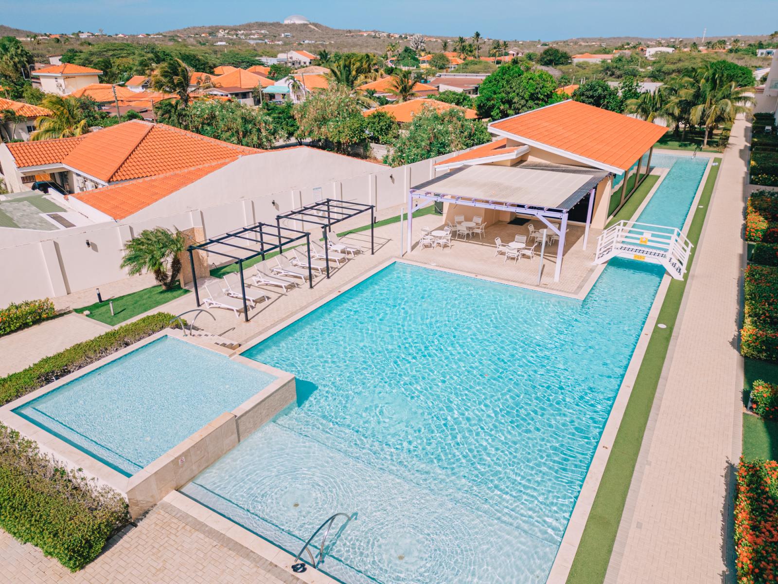 Savor the sunshine at the inviting shared pool area