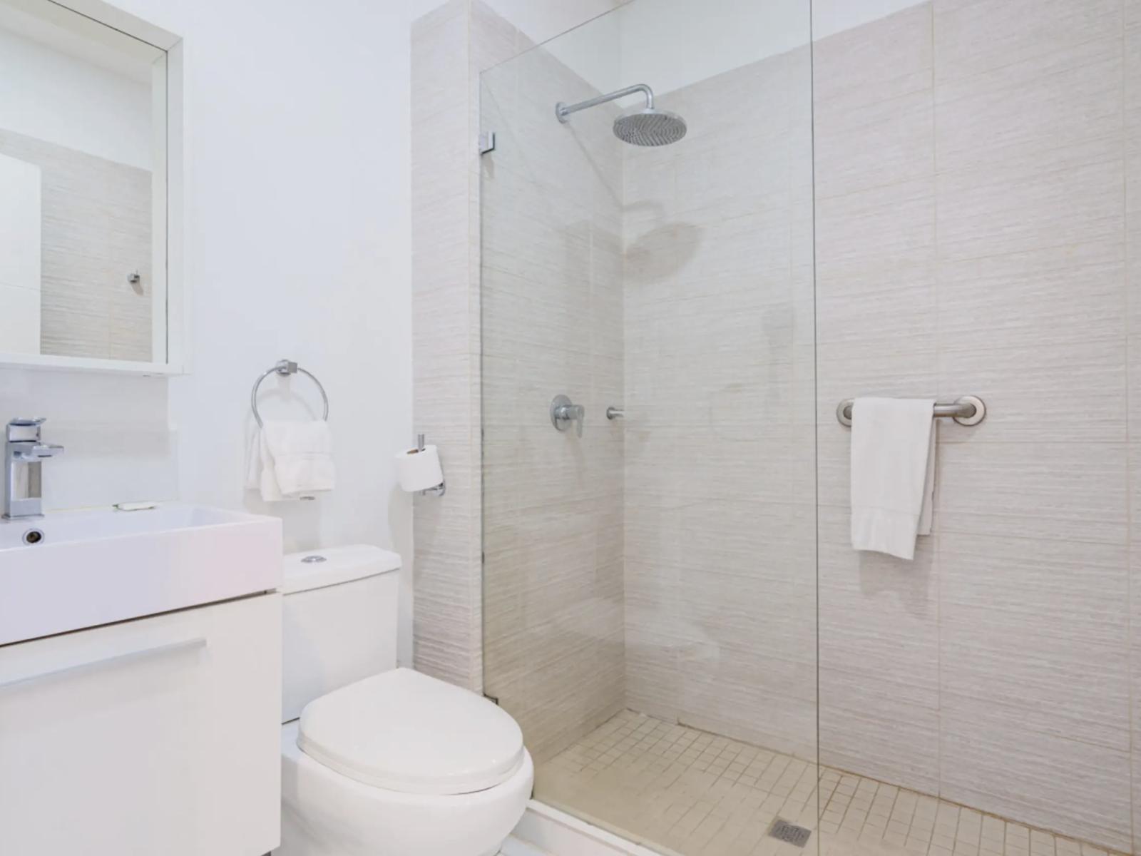 Bathroom 2 with a walk in shower and modern finishes