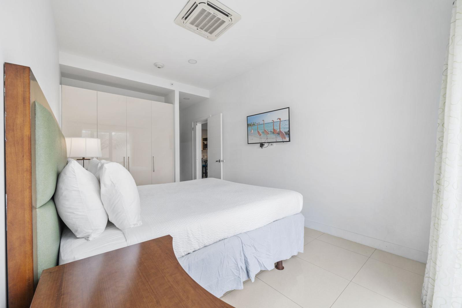Bedroom 1 features a king size bed and a smart TV