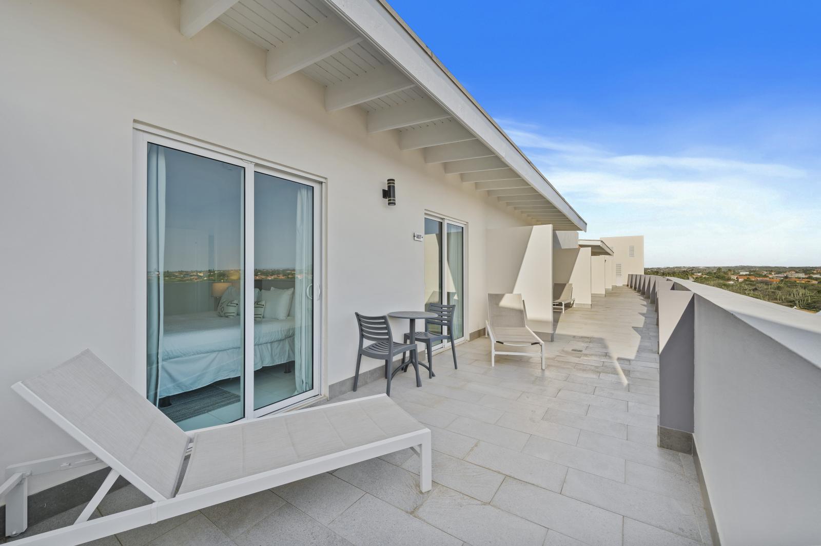 Private top floor patio with luonge chairs