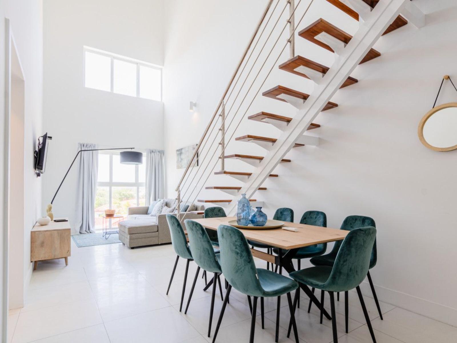 Open concept living and dining area in the condo