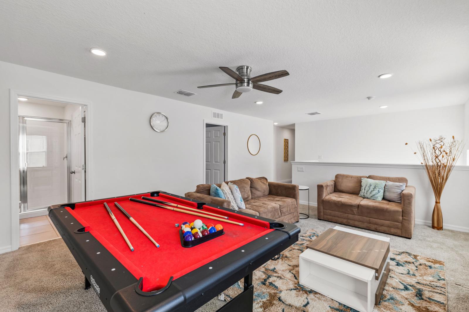 Loft area with a smart tv and  a pool table