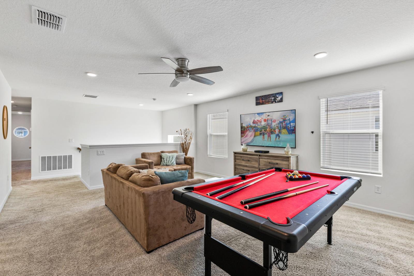 Loft area with a smart tv and  a pool table