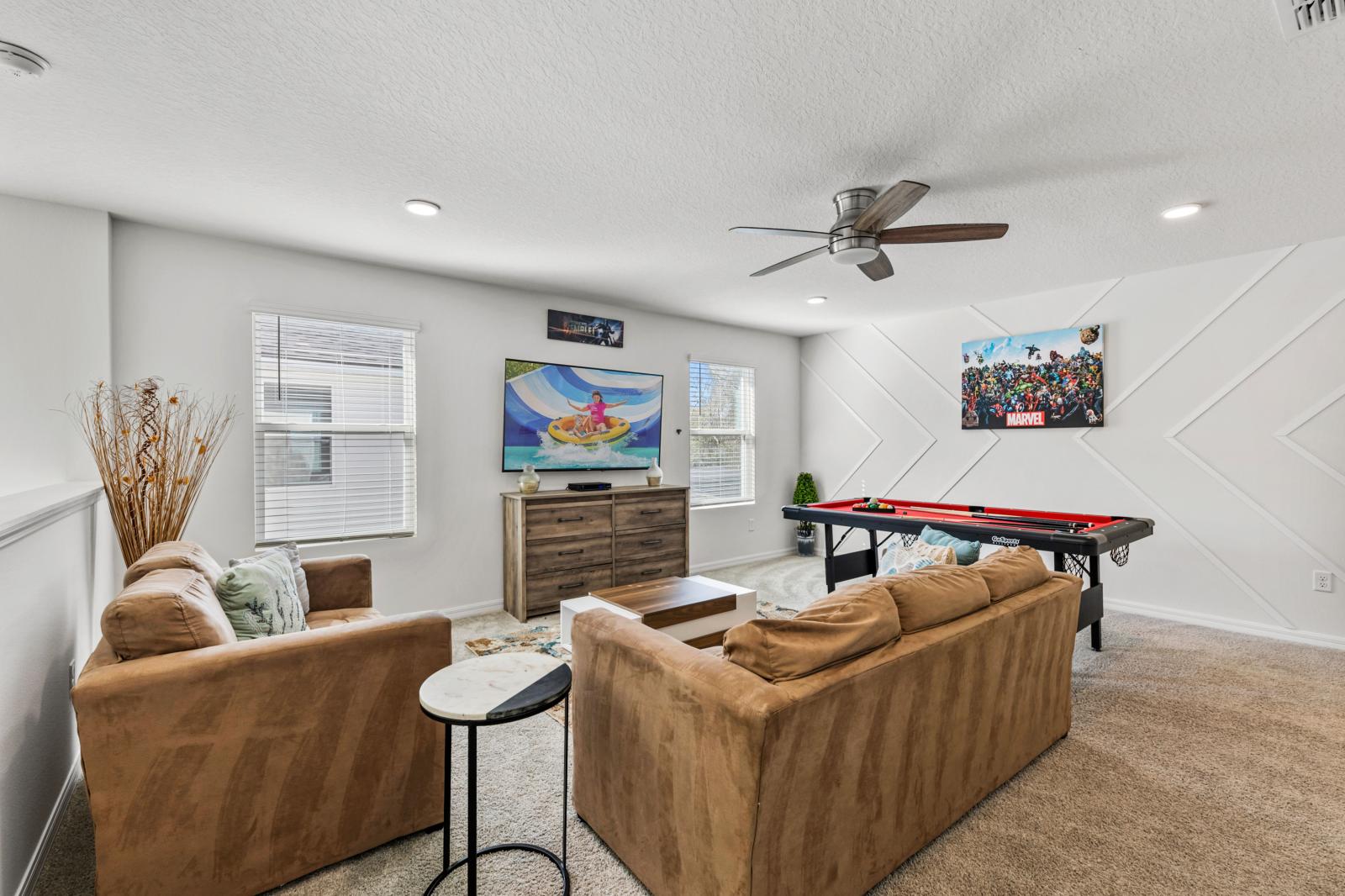 Loft area with a smart tv and  a pool table