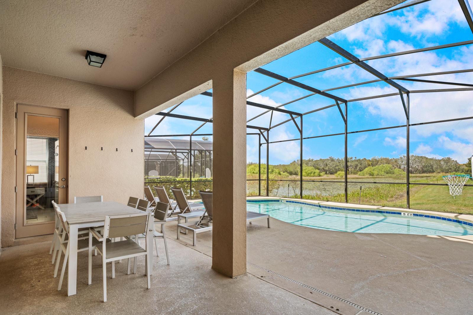 Private pool with an outdoor dining area