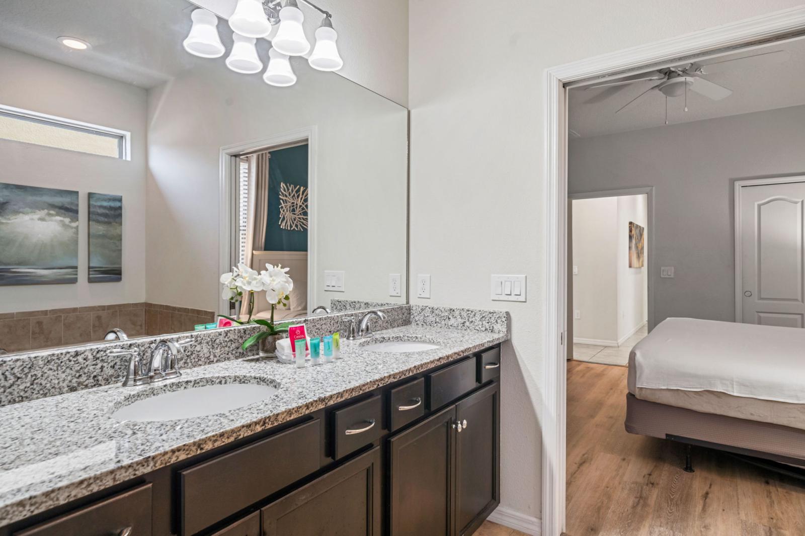 Bathroom 1 with a walk in shower and a bathtub