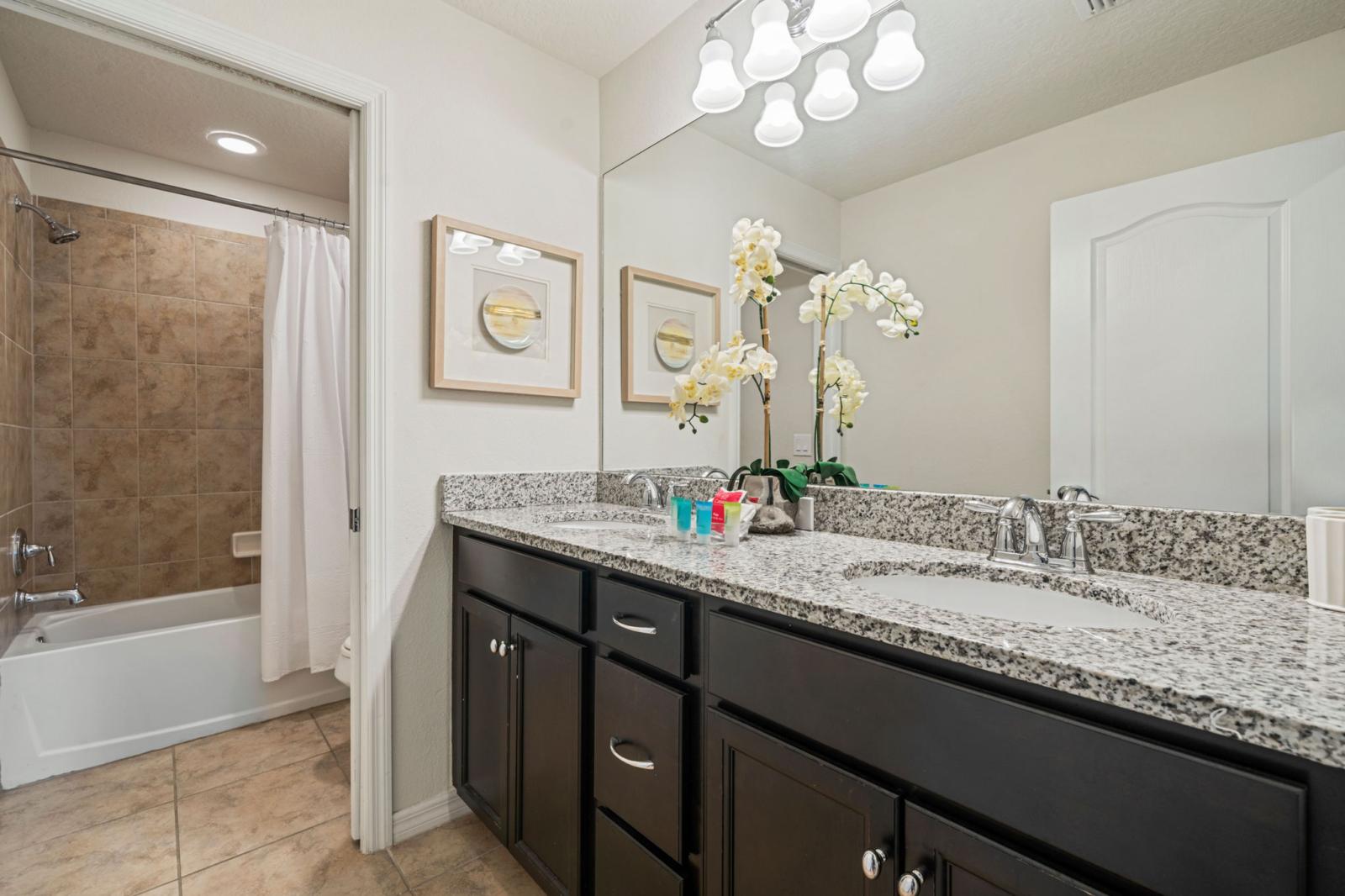 Bathroom 4 with a bathtub and shower combination
