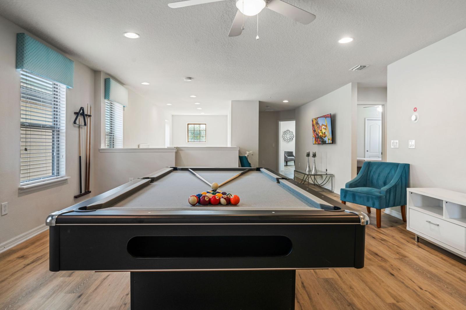Loft area with a pool table