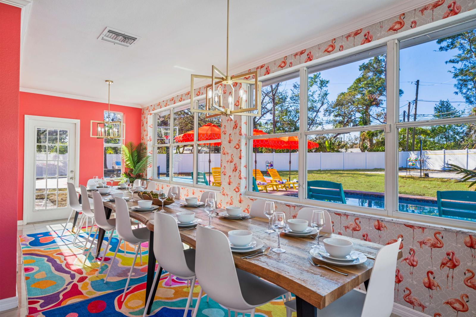 Spacious, sun-soaked dining room with picturesque views of the backyard