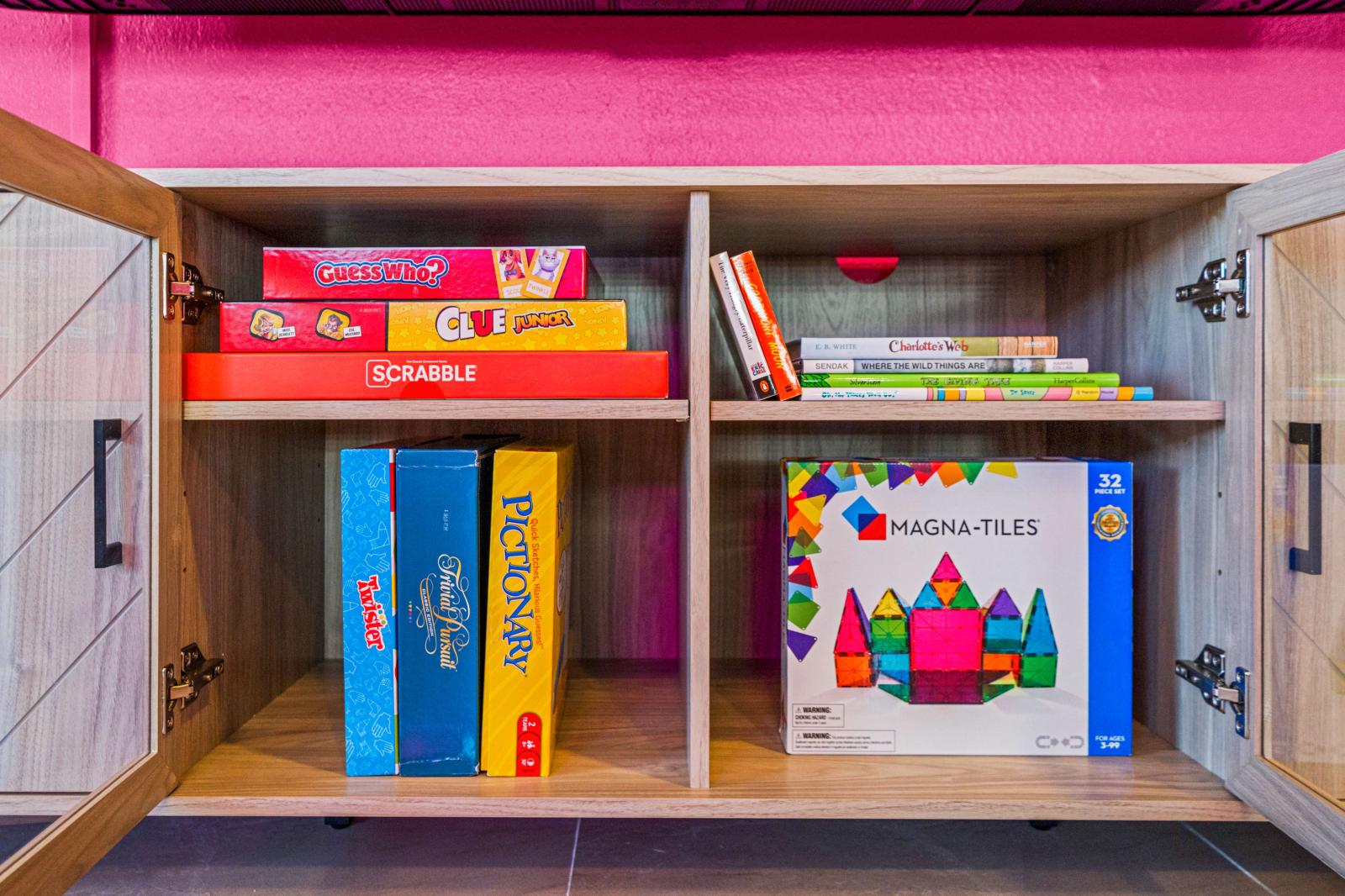 Living room with large 75" smart TV and board games