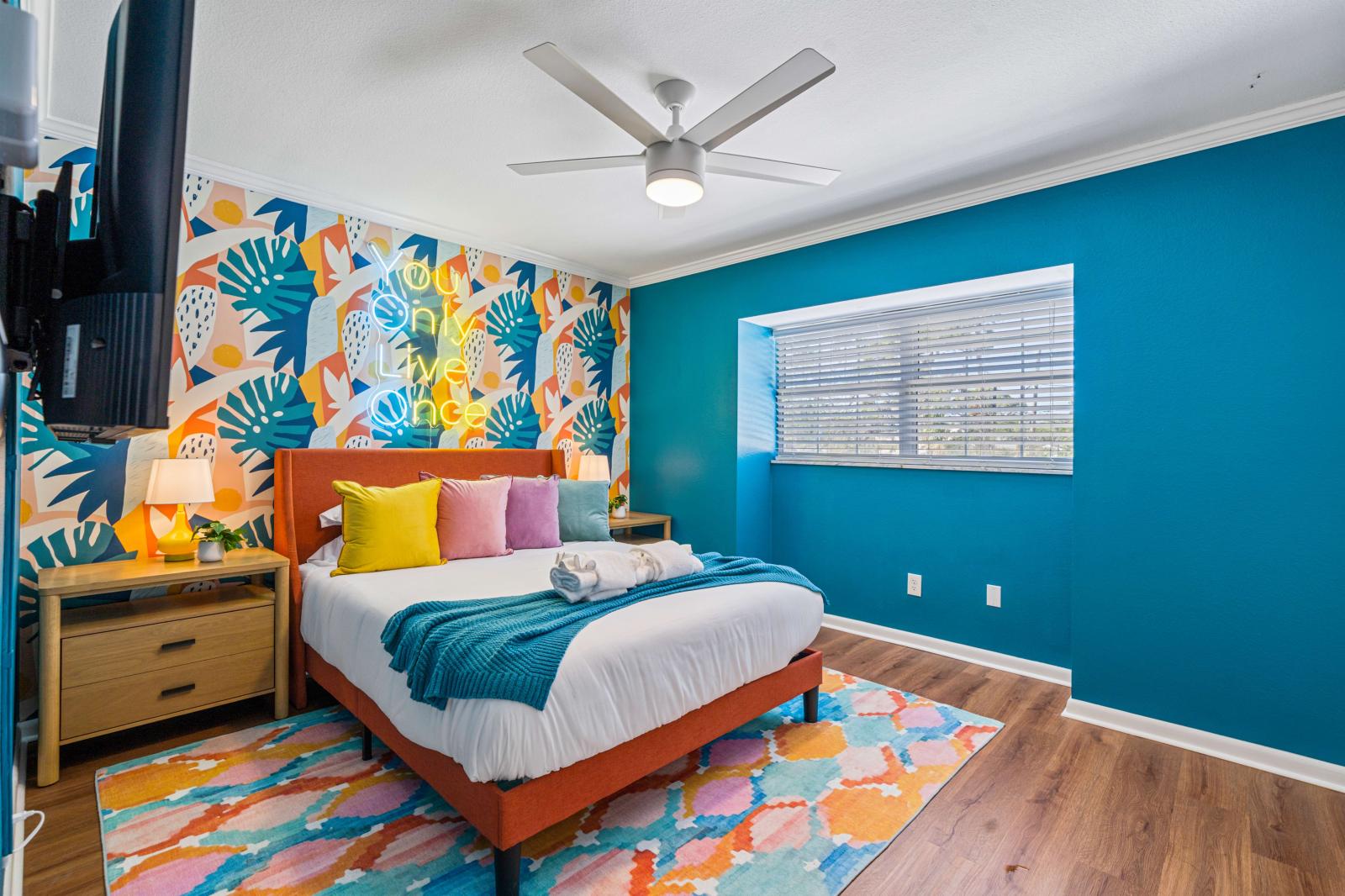 Bedroom 5: Charming queen-size bedroom on the second floor, complete with a refreshing ceiling fan, a large 65" smart TV, and all the comforts needed for a relaxing stay.