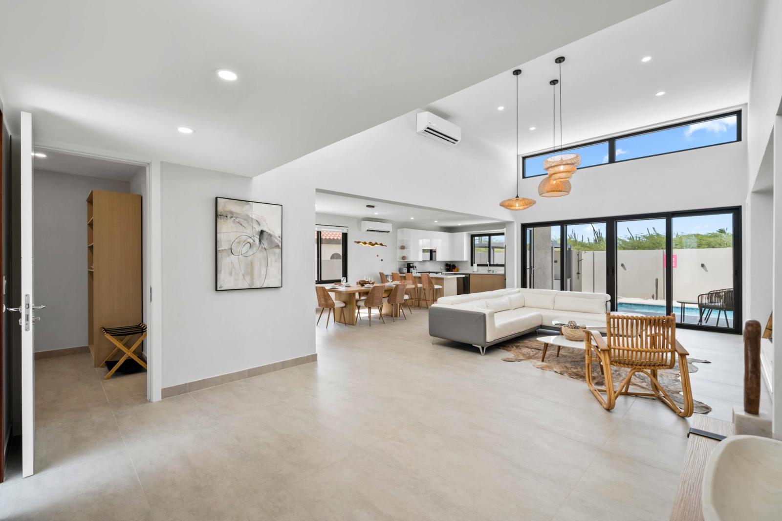 Open concept design with high ceilings and a natural, airy feel - A blend of comfort and style, with plenty of space for dining, lounging, and entertaining - Enjoy effortless indoor outdoor living with large sliding doors leading to the patio