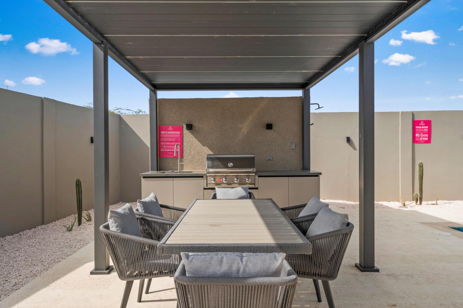 Fire up the BBQ grill and enjoy delicious meals in this shaded outdoor dining space - Gather with friends & family for relaxed alfresco dining just steps from the pool - Perfect spot to unwind, share laughs & make unforgettable vacation memories