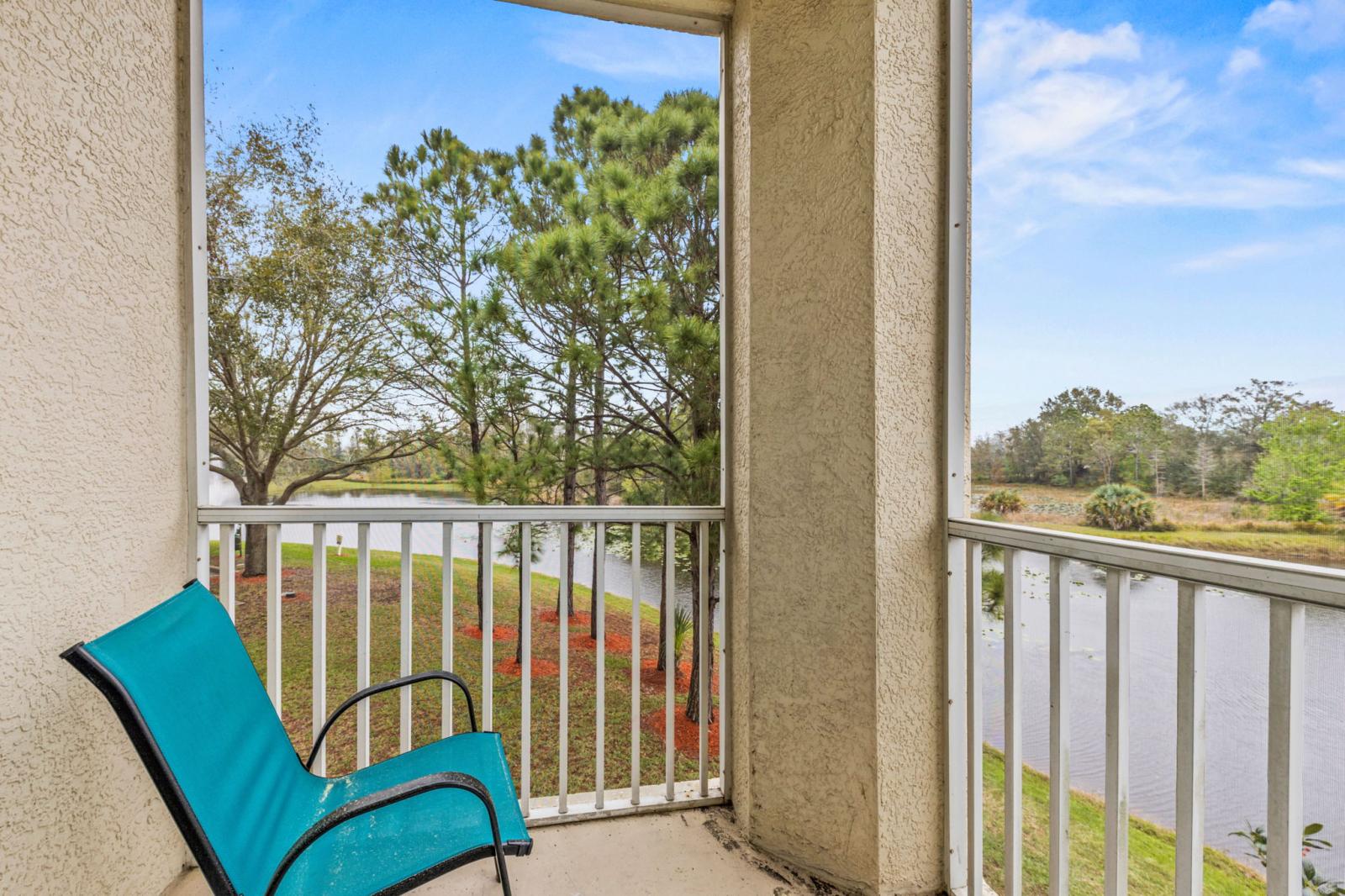 Morning coffee with a view! Enjoy the peaceful lake views from your screened-in balcony – the perfect spot to start or end your day!