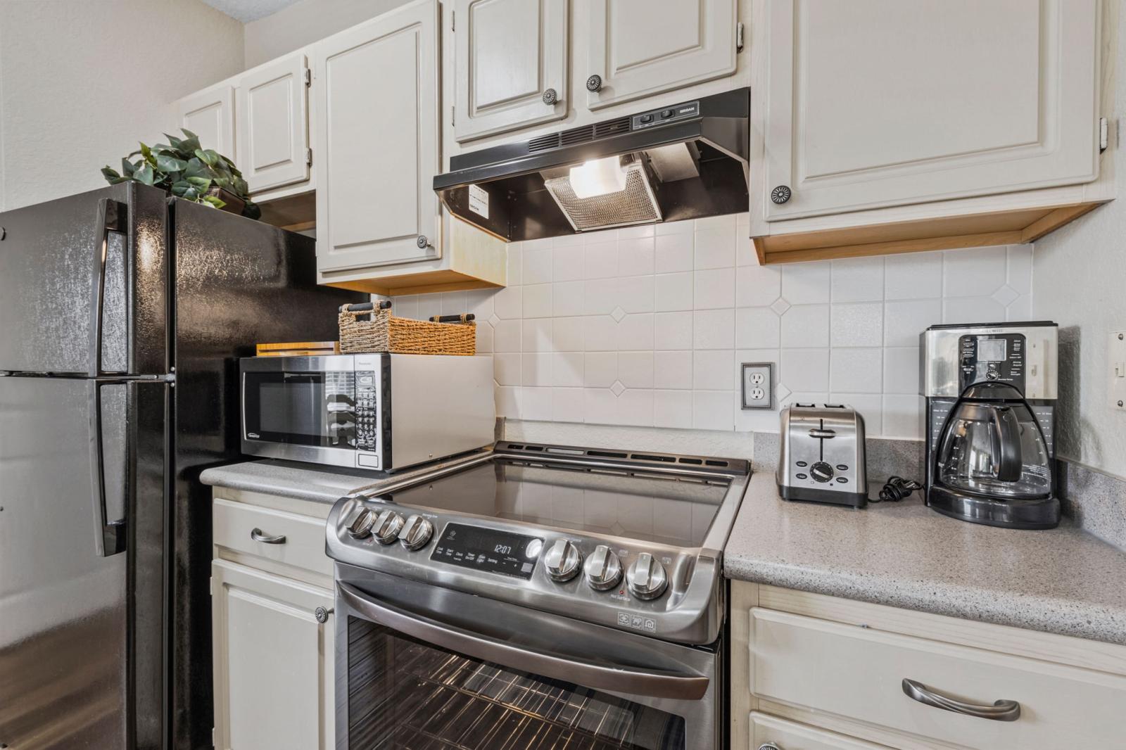 The kitchen cabinets are fully stocked with dinner plates, salad plates, bowls, and coffee mugs to accommodate any time of day during your stay.