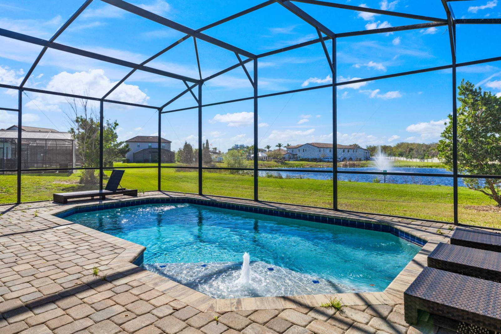 Relax & Unwind! Enjoy your private screened-in pool with stunning lake & fountain views—the perfect spot to soak up the Florida sunshine!