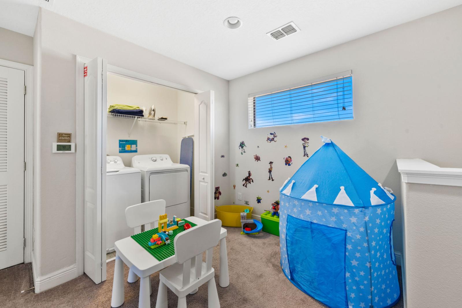 This cozy nook is perfect for little adventurers! Featuring a fun Toy Story-themed play area, a charming castle tent, and a built-in laundry space for convenience.