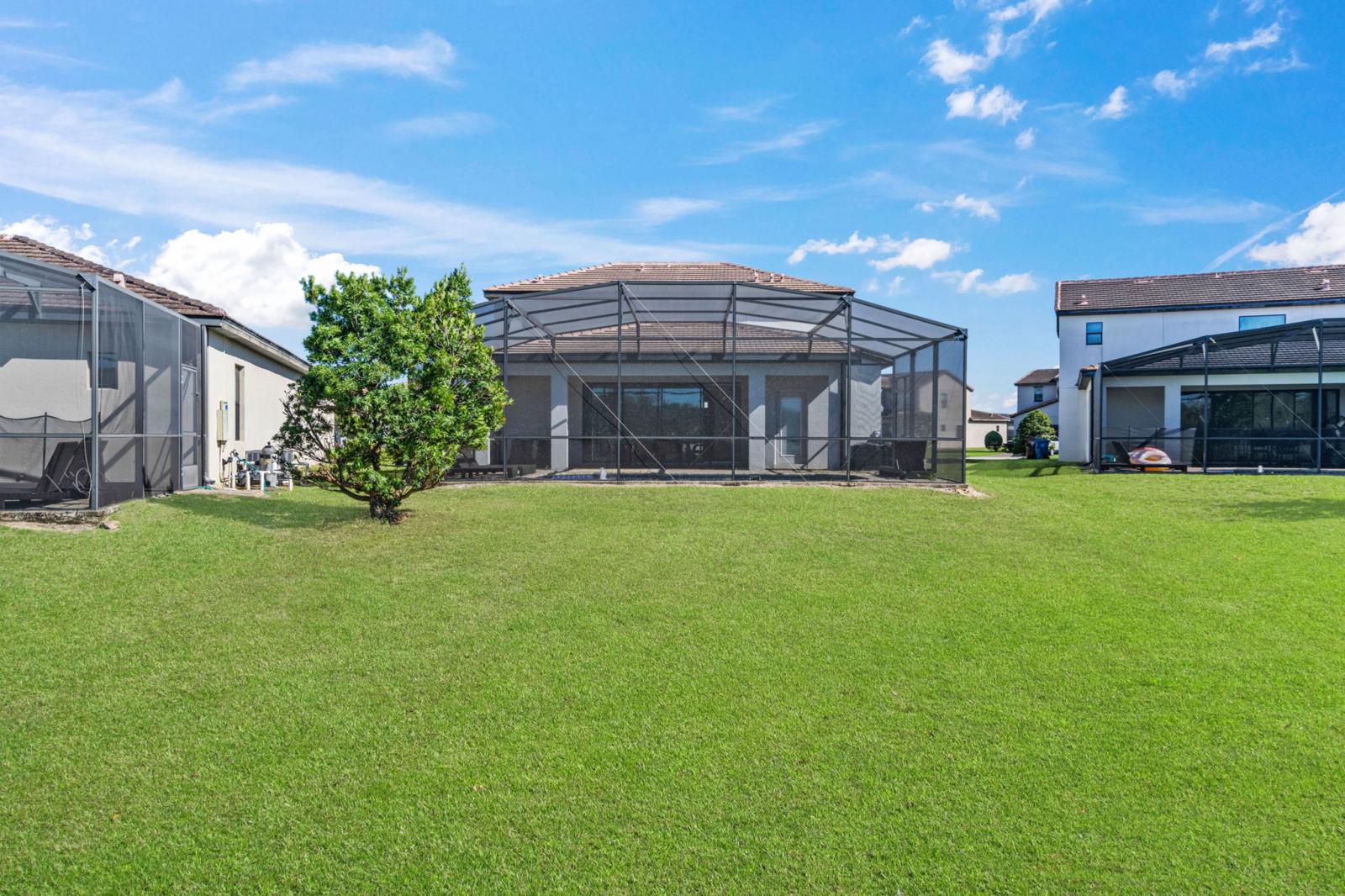 Enjoy the view of the lake from the screened in pool deck.