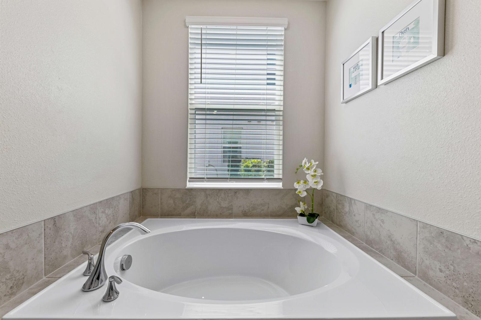 Bathroom 1 with a bathtub and a walk-in shower