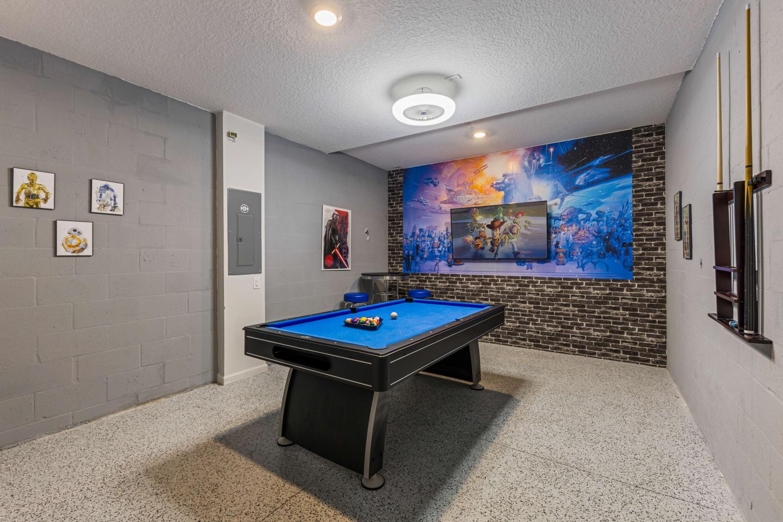 Game area with a pool table and a Smart TV