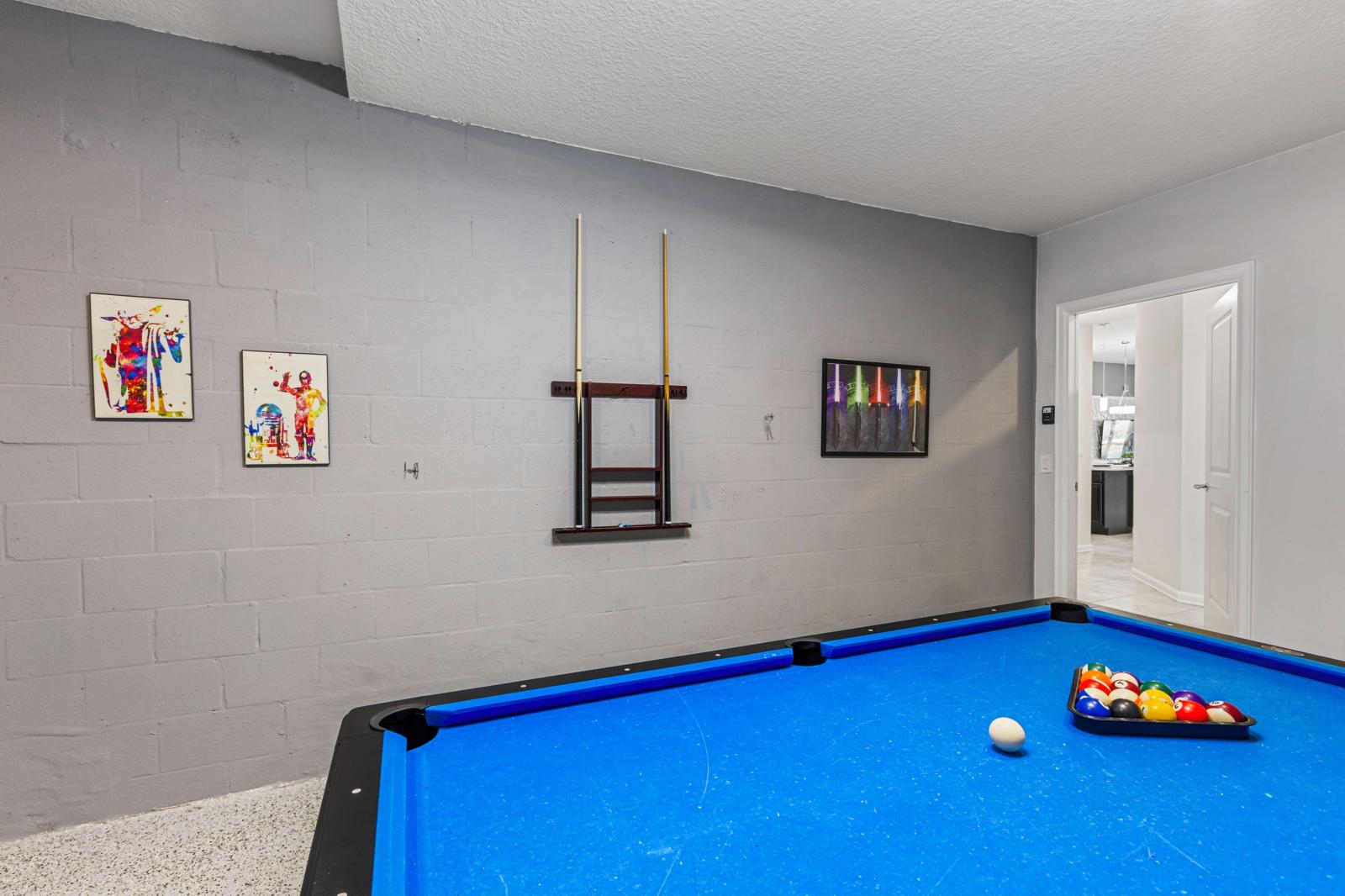 Game area with a pool table and a Smart TV