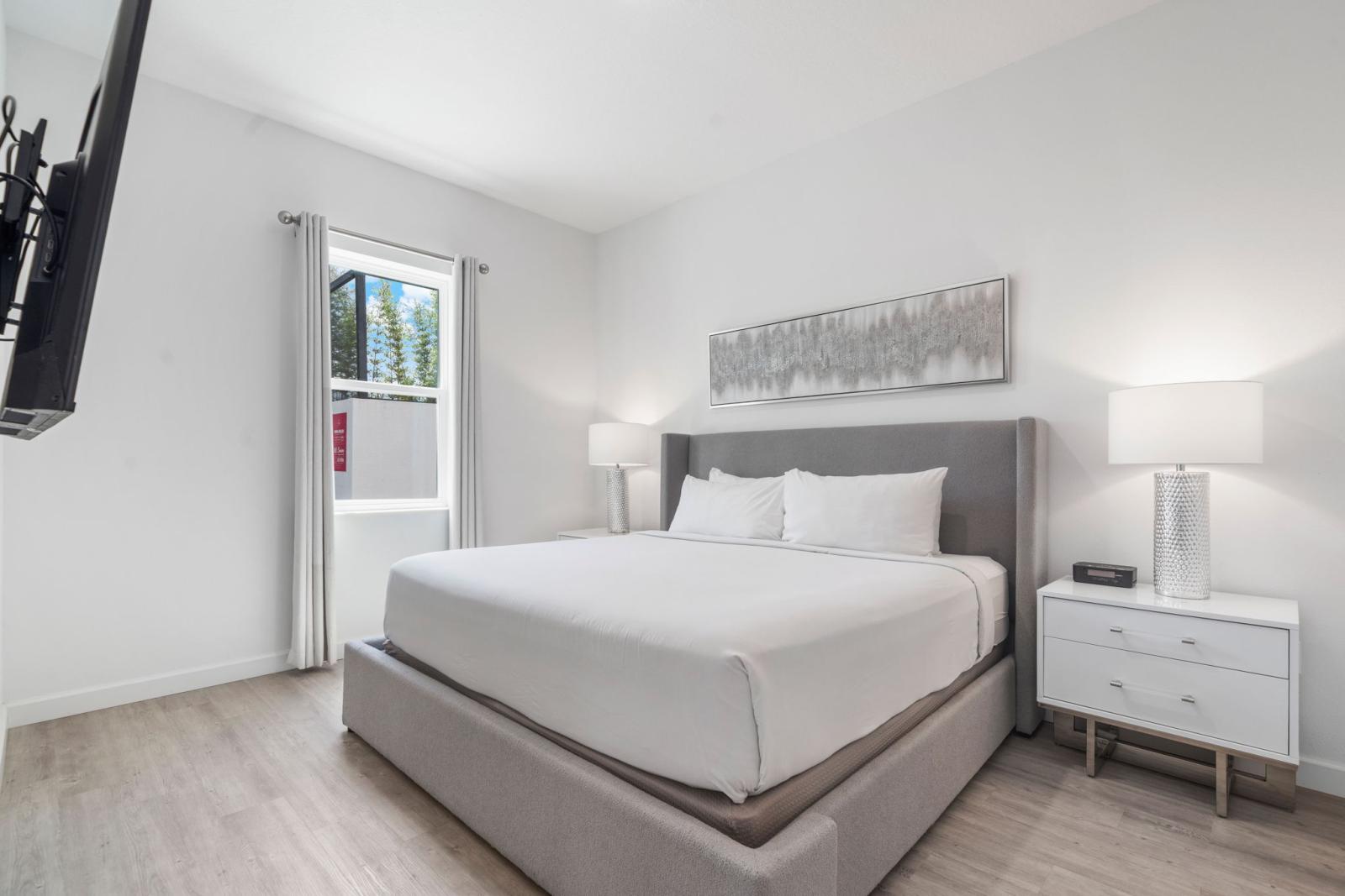 Bedroom 1 with a king size bed and a private bathroom