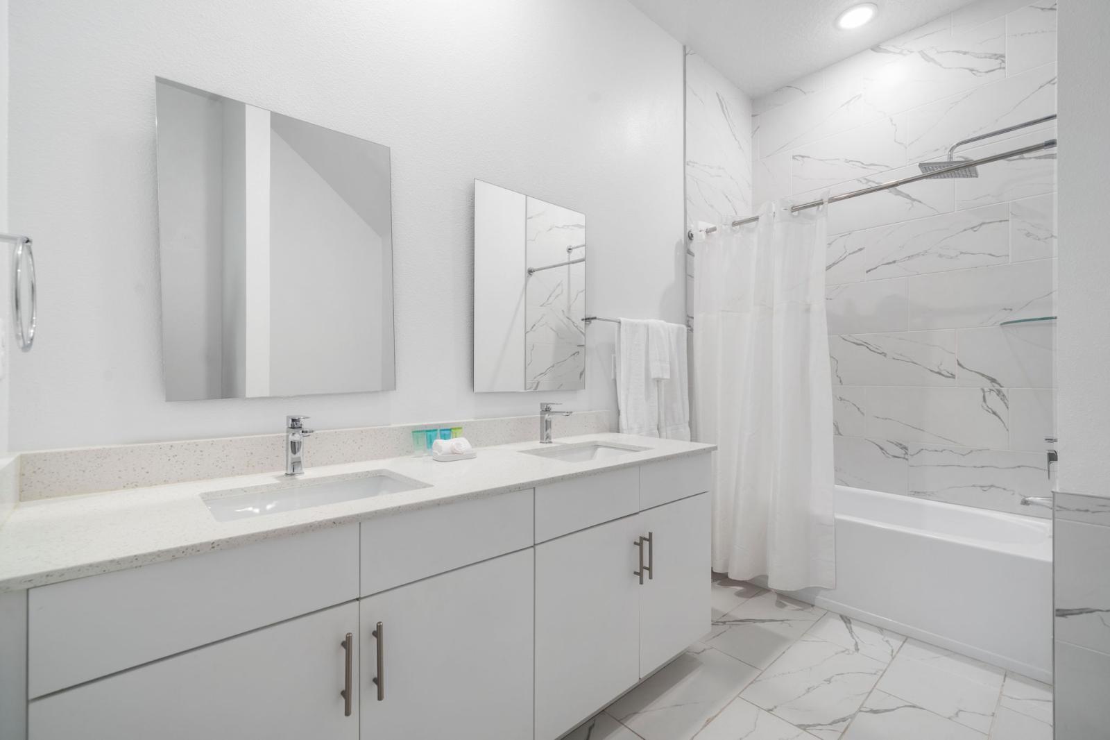 Bathroom 1 with a bathtub and shower combo
