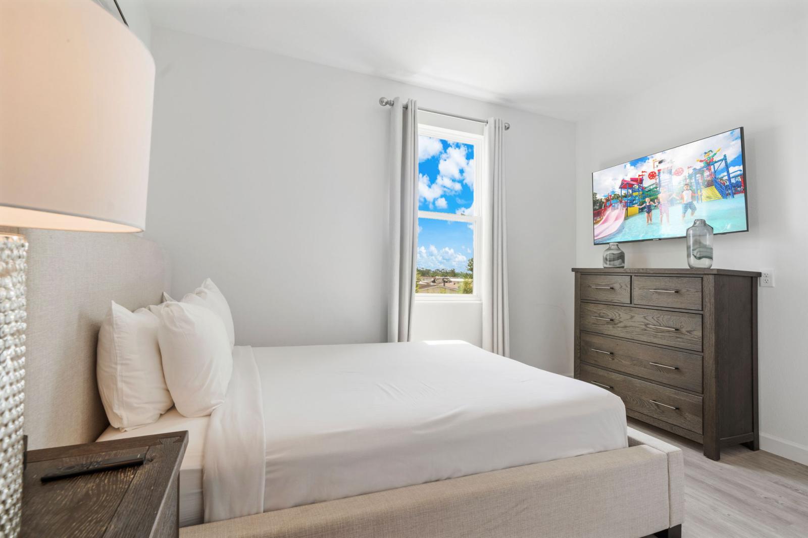 Bedroom 4 with a queen size bed  and a smart TV
