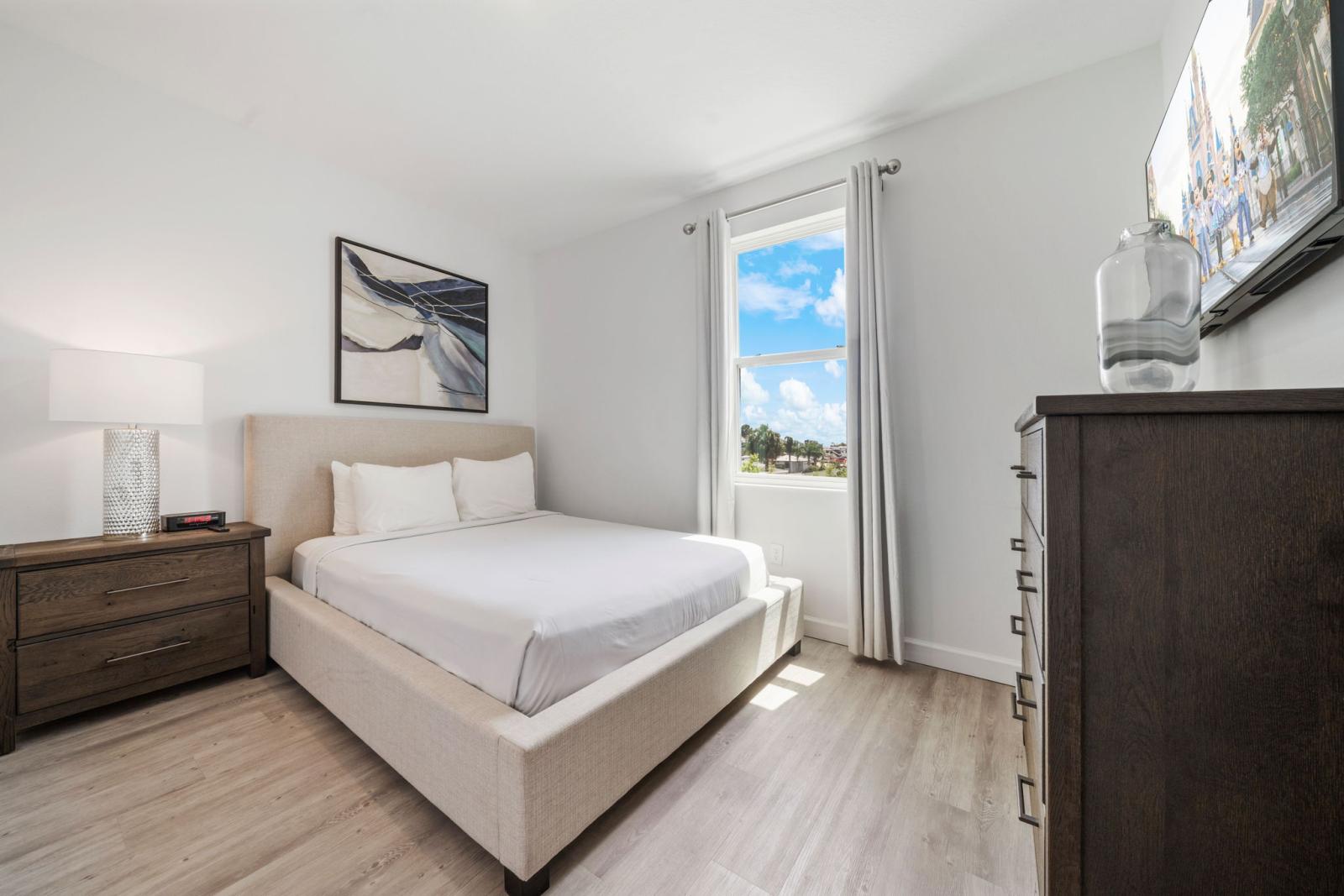 Bedroom 4 with a queen size bed  and a smart TV