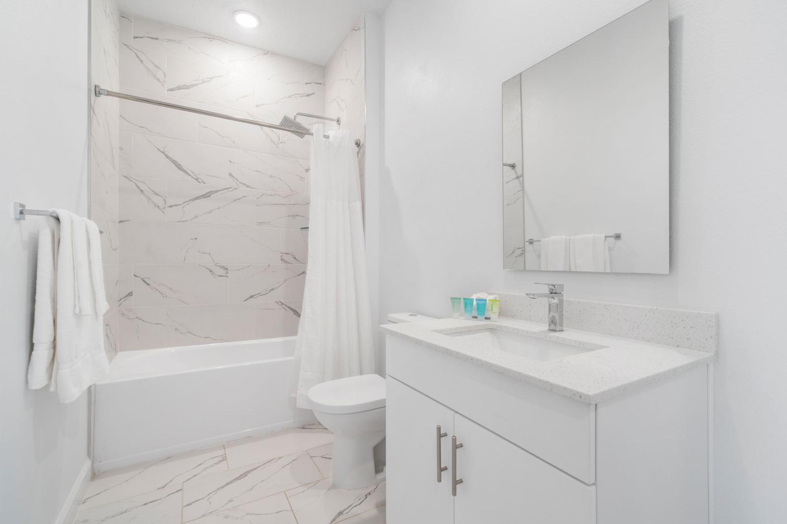 Bathroom 3 with a bathtub and a shower combo