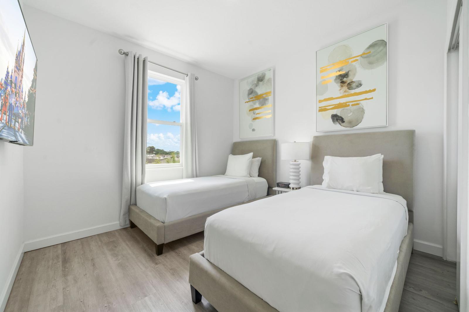 Bedroom 5 with 2 single beds and a smart TV