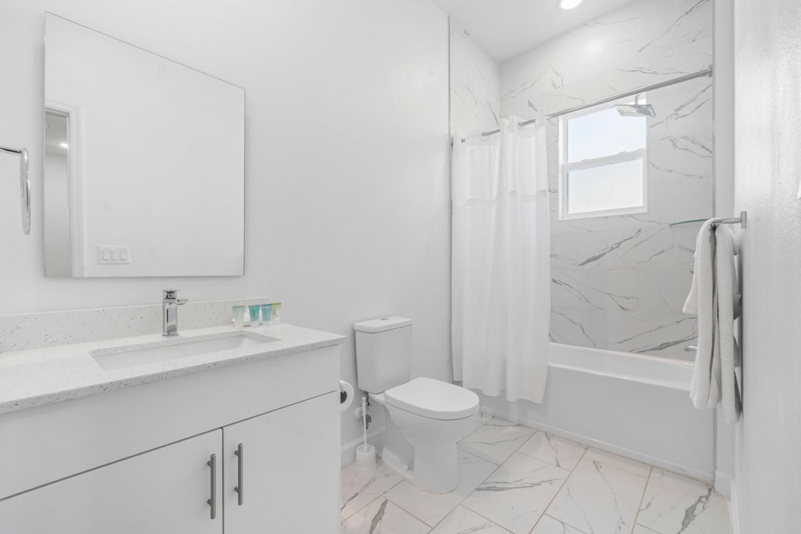 Bathroom 4 with a bathtub and a shower combo