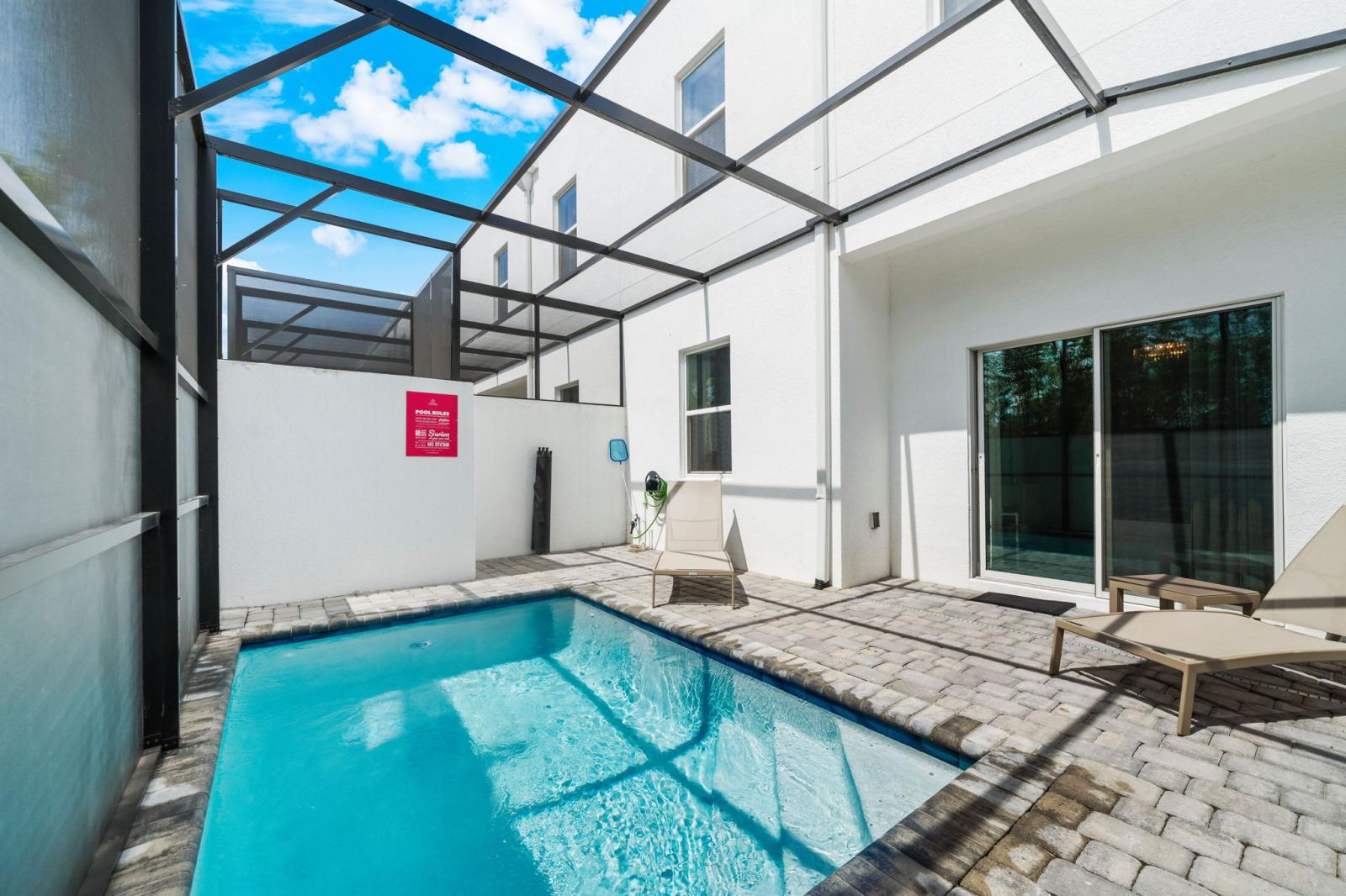 Private pool with BBQ grill and lounge chairs