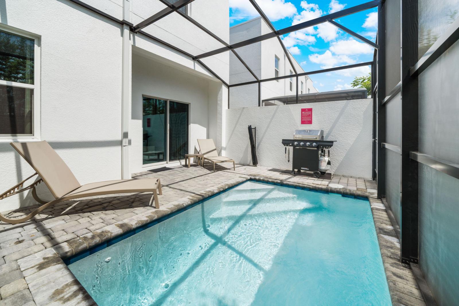 Private pool with BBQ grill and lounge chairs