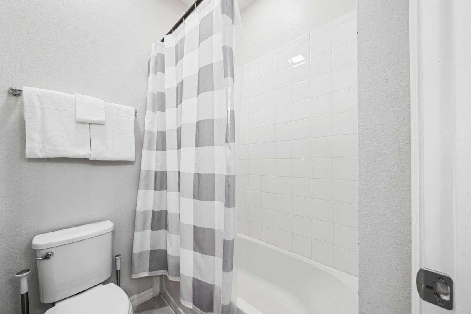 Bathroom 6 with a bathtub and a shower combination