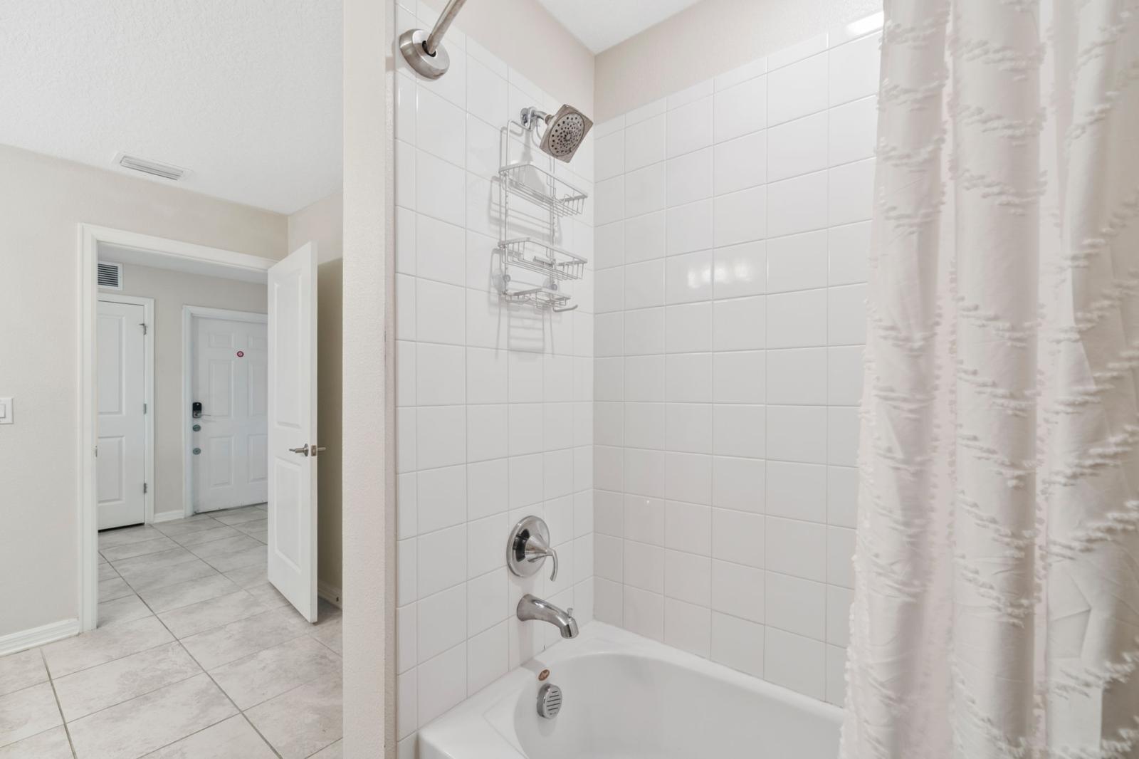 Bathroom 2 with a bathtub and shower combo